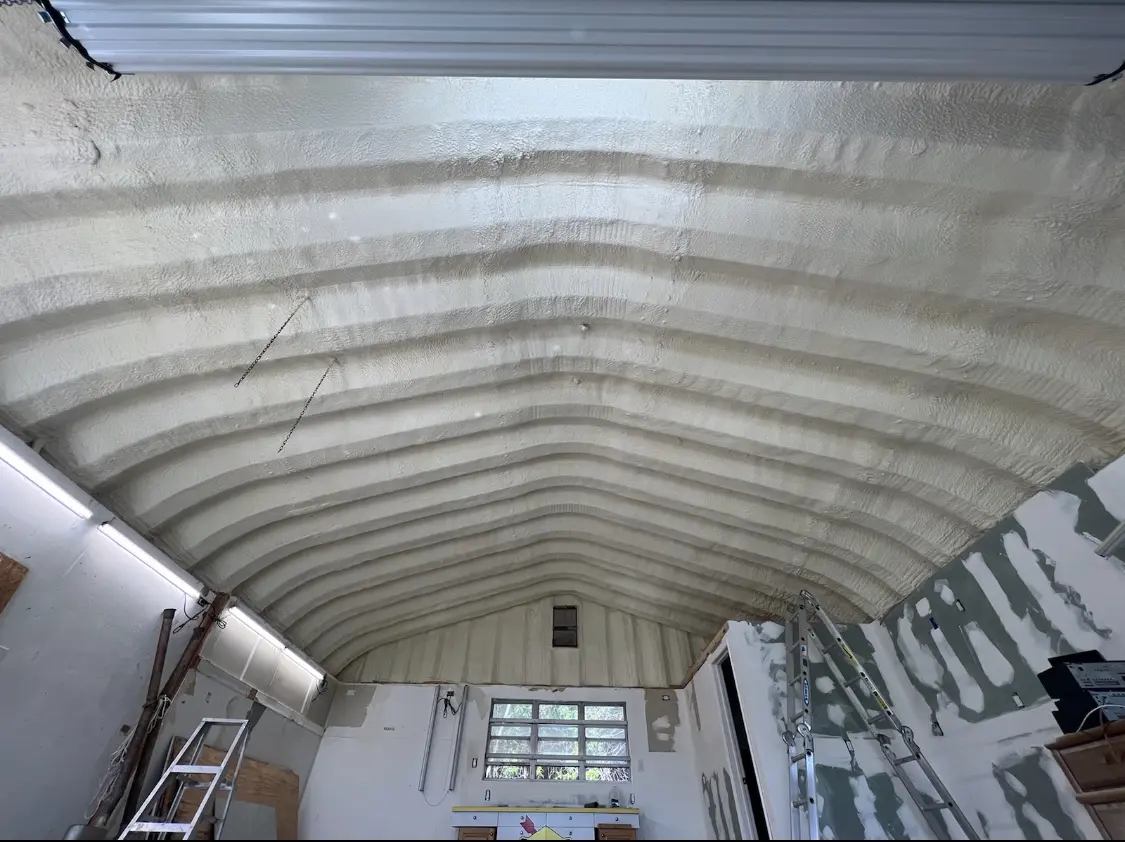 Spray polyurethane foam applied to the underside of a metal roof deck in Springboro